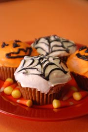 Pumpkin cupcakes with Ginger Cream Cheese Frosting Halloween recipe. By Beyond Wonderful Baking Expert, Catherine Christensen.