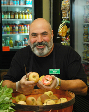 Dan Avakian demonstrates the Pink Pearl apple.