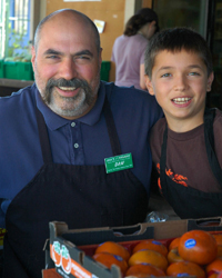 Dan Avakian with his son, Joe, at their open-air produce market in the San Francisco Bay Area.