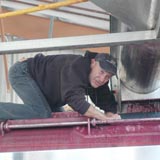 Greg atop the press.  Careful buddy.