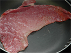 Fry the steak for Mexican Carne Asada.