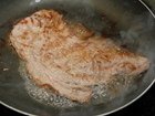Finish frying the steak for Mexican Carne Asada.